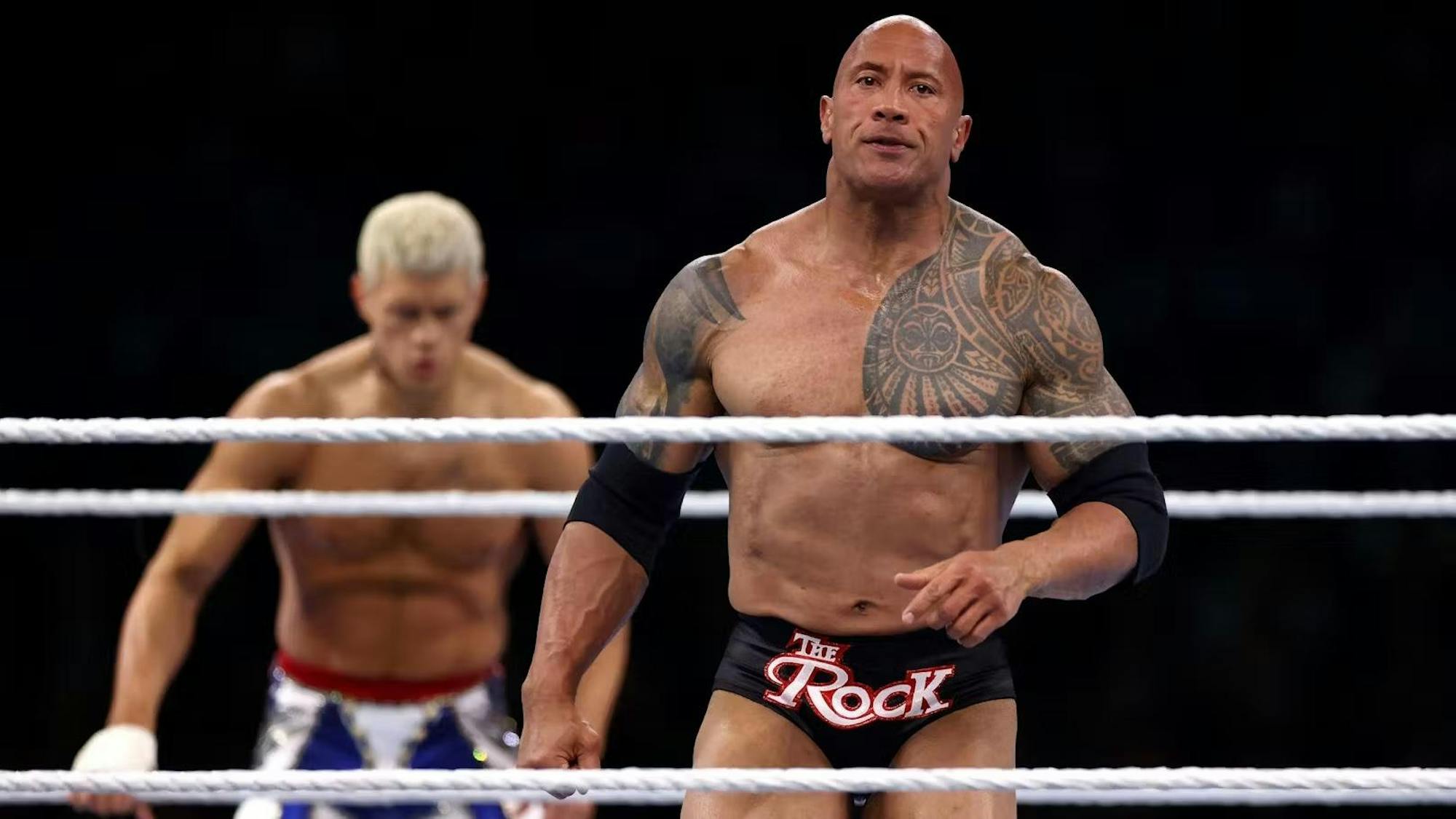 The Smashing Machine performing powerful moves in a high-intensity combat sports match